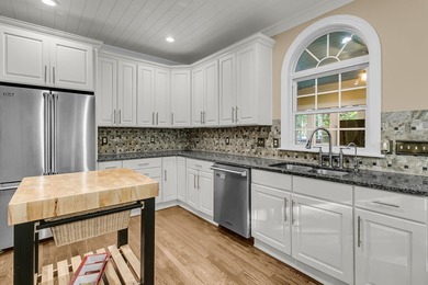 Situated on over an acre along the fourth hole of the Dunes West on Dunes West Golf Club in South Carolina - for sale on GolfHomes.com, golf home, golf lot