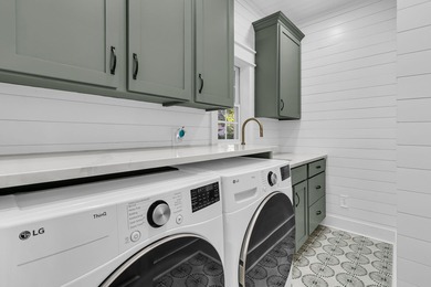 Situated on over an acre along the fourth hole of the Dunes West on Dunes West Golf Club in South Carolina - for sale on GolfHomes.com, golf home, golf lot