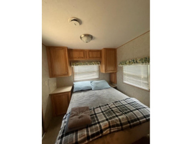 Large Park Trailer with two bedrooms.  One and one half on Captains Cove Golf and Yacht Club in Virginia - for sale on GolfHomes.com, golf home, golf lot