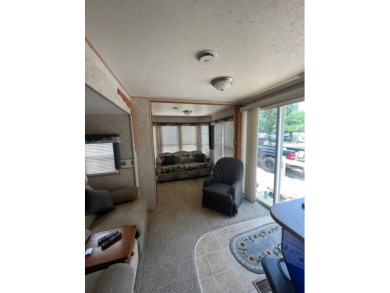 Large Park Trailer with two bedrooms.  One and one half on Captains Cove Golf and Yacht Club in Virginia - for sale on GolfHomes.com, golf home, golf lot