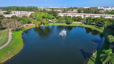 Discover resplendent living at the serene 2802 Victoria Way K4 on Wynmoor Golf Course in Florida - for sale on GolfHomes.com, golf home, golf lot