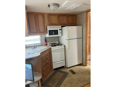 Large Park Trailer with two bedrooms.  One and one half on Captains Cove Golf and Yacht Club in Virginia - for sale on GolfHomes.com, golf home, golf lot