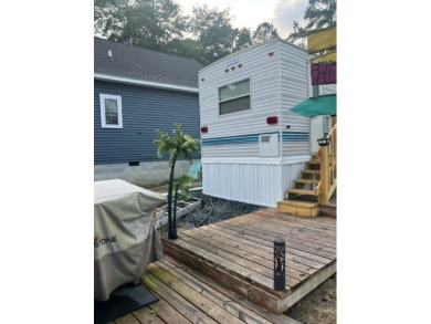 Large Park Trailer with two bedrooms.  One and one half on Captains Cove Golf and Yacht Club in Virginia - for sale on GolfHomes.com, golf home, golf lot