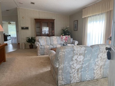 Enjoy the Florida lifestyle in this furnished mobile home in on Spanish Lakes Fairways in Florida - for sale on GolfHomes.com, golf home, golf lot