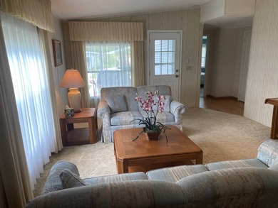 Enjoy the Florida lifestyle in this furnished mobile home in on Spanish Lakes Fairways in Florida - for sale on GolfHomes.com, golf home, golf lot