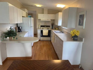 Enjoy the Florida lifestyle in this furnished mobile home in on Spanish Lakes Fairways in Florida - for sale on GolfHomes.com, golf home, golf lot