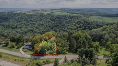 This stunning lot offers a level building site, just across from on Coffee Mill Golf and Country Club in Minnesota - for sale on GolfHomes.com, golf home, golf lot