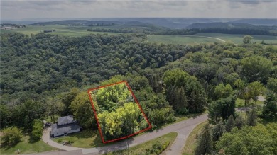 This stunning lot offers a level building site, just across from on Coffee Mill Golf and Country Club in Minnesota - for sale on GolfHomes.com, golf home, golf lot