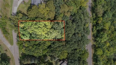 This stunning lot offers a level building site, just across from on Coffee Mill Golf and Country Club in Minnesota - for sale on GolfHomes.com, golf home, golf lot