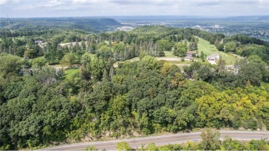 This stunning lot offers a level building site, just across from on Coffee Mill Golf and Country Club in Minnesota - for sale on GolfHomes.com, golf home, golf lot