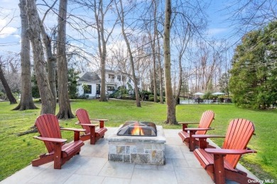Set far off a wooded cul-de-sac on 1.94 enchanting acres backing on Nassau Country Club in New York - for sale on GolfHomes.com, golf home, golf lot