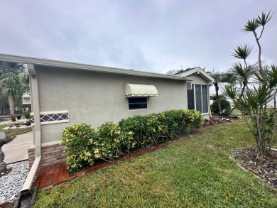 Beautiful stucco home on the exterior perimeter.  Updated on Del Tura Golf and Country Club in Florida - for sale on GolfHomes.com, golf home, golf lot