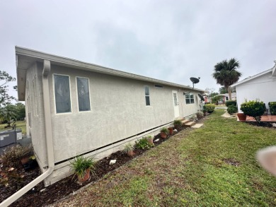Beautiful stucco home on the exterior perimeter.  Updated on Del Tura Golf and Country Club in Florida - for sale on GolfHomes.com, golf home, golf lot