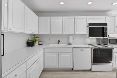 Welcome to this spacious and beautifully located first-floor on Hunters Run Golf and Country Club in Florida - for sale on GolfHomes.com, golf home, golf lot