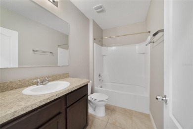 This charming 4-bedroom, 2-bathroom single-family home is on Highlands Reserve Golf Club in Florida - for sale on GolfHomes.com, golf home, golf lot