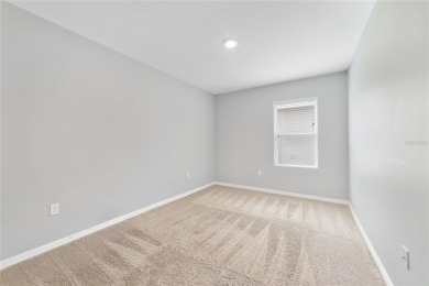 This charming 4-bedroom, 2-bathroom single-family home is on Highlands Reserve Golf Club in Florida - for sale on GolfHomes.com, golf home, golf lot