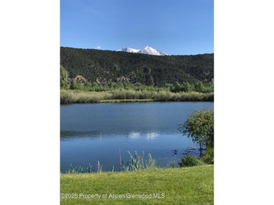 Rarely available and highly desirable ground floor pondside on Ranch at Roaring Fork Golf Course in Colorado - for sale on GolfHomes.com, golf home, golf lot