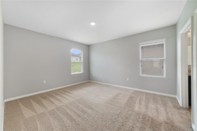 This charming 4-bedroom, 2-bathroom single-family home is on Highlands Reserve Golf Club in Florida - for sale on GolfHomes.com, golf home, golf lot