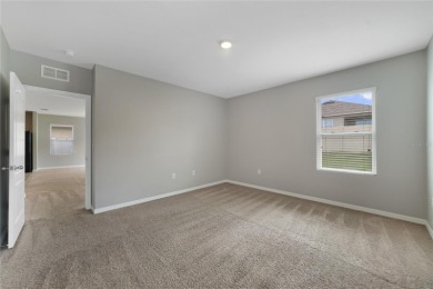 This charming 4-bedroom, 2-bathroom single-family home is on Highlands Reserve Golf Club in Florida - for sale on GolfHomes.com, golf home, golf lot
