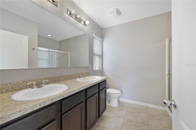 This charming 4-bedroom, 2-bathroom single-family home is on Highlands Reserve Golf Club in Florida - for sale on GolfHomes.com, golf home, golf lot