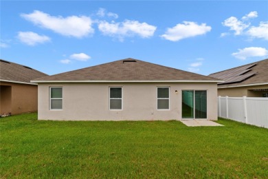 This charming 4-bedroom, 2-bathroom single-family home is on Highlands Reserve Golf Club in Florida - for sale on GolfHomes.com, golf home, golf lot