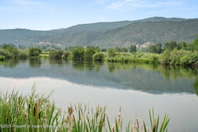 Rarely available and highly desirable ground floor pondside on Ranch at Roaring Fork Golf Course in Colorado - for sale on GolfHomes.com, golf home, golf lot