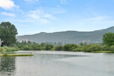 Rarely available and highly desirable ground floor pondside on Ranch at Roaring Fork Golf Course in Colorado - for sale on GolfHomes.com, golf home, golf lot