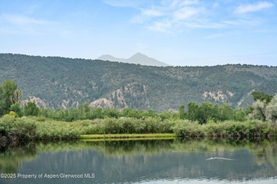 Rarely available and highly desirable ground floor pondside on Ranch at Roaring Fork Golf Course in Colorado - for sale on GolfHomes.com, golf home, golf lot