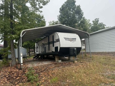 Check out this 2023 Forest River Wildwood Platinum 2 bedroom, 1 on River Ridge Golf Club in Virginia - for sale on GolfHomes.com, golf home, golf lot