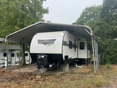 Check out this 2023 Forest River Wildwood Platinum 2 bedroom, 1 on River Ridge Golf Club in Virginia - for sale on GolfHomes.com, golf home, golf lot