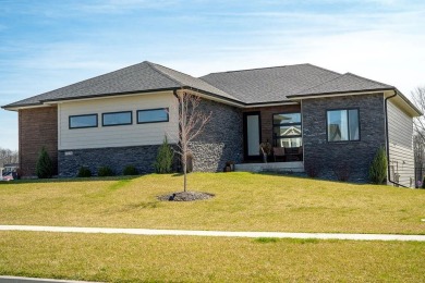 Discover this exquisite home nestled beside the Arnold Palmer on Tournament Club of Iowa in Iowa - for sale on GolfHomes.com, golf home, golf lot
