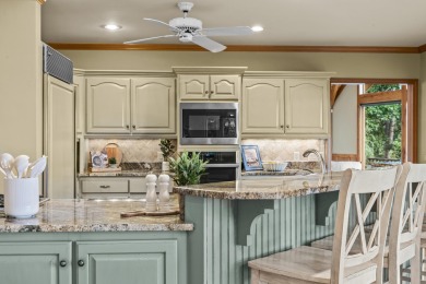 This beautifully maintained golf course home offers sweeping on Reynolds Lake Oconee - The Landing in Georgia - for sale on GolfHomes.com, golf home, golf lot