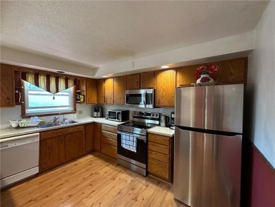 Welcome to 350 Lake Hill Drive! This 4-bed, 2-bath split-foyer on Worthington Country Club in Minnesota - for sale on GolfHomes.com, golf home, golf lot