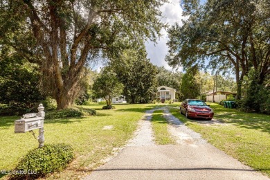 Location is everything! Bring the golf cart! Perfect for great on Gulf Hills Golf Club in Mississippi - for sale on GolfHomes.com, golf home, golf lot