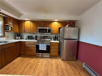 Welcome to 350 Lake Hill Drive! This 4-bed, 2-bath split-foyer on Worthington Country Club in Minnesota - for sale on GolfHomes.com, golf home, golf lot