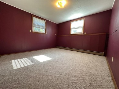 Welcome to 350 Lake Hill Drive! This 4-bed, 2-bath split-foyer on Worthington Country Club in Minnesota - for sale on GolfHomes.com, golf home, golf lot