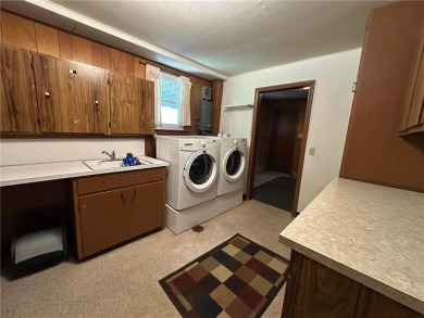 Welcome to 350 Lake Hill Drive! This 4-bed, 2-bath split-foyer on Worthington Country Club in Minnesota - for sale on GolfHomes.com, golf home, golf lot