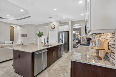 Experience elevated Florida living in this elegantly upgraded on Esplanade Golf and Country at Lakewood Ranch in Florida - for sale on GolfHomes.com, golf home, golf lot