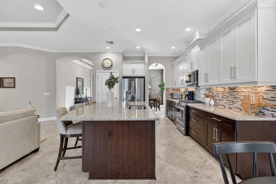 Experience elevated Florida living in this elegantly upgraded on Esplanade Golf and Country at Lakewood Ranch in Florida - for sale on GolfHomes.com, golf home, golf lot