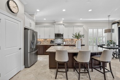 Experience elevated Florida living in this elegantly upgraded on Esplanade Golf and Country at Lakewood Ranch in Florida - for sale on GolfHomes.com, golf home, golf lot