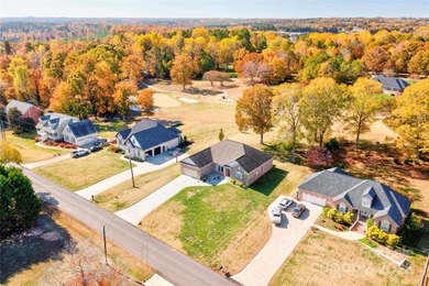 Welcome to 128 Harbourtown Drive - Woodbridge Subdivision. This on Woodbridge Golf Links in North Carolina - for sale on GolfHomes.com, golf home, golf lot