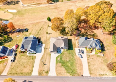 Welcome to 128 Harbourtown Drive - Woodbridge Subdivision. This on Woodbridge Golf Links in North Carolina - for sale on GolfHomes.com, golf home, golf lot