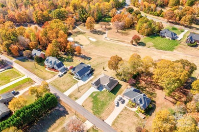 Welcome to 128 Harbourtown Drive - Woodbridge Subdivision. This on Woodbridge Golf Links in North Carolina - for sale on GolfHomes.com, golf home, golf lot