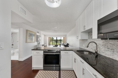 Wake up to tranquil lake and golf course views in this on Fountains Golf and Country Club in Florida - for sale on GolfHomes.com, golf home, golf lot