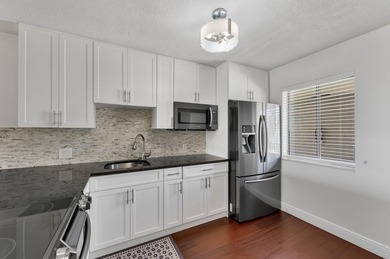 Wake up to tranquil lake and golf course views in this on Fountains Golf and Country Club in Florida - for sale on GolfHomes.com, golf home, golf lot