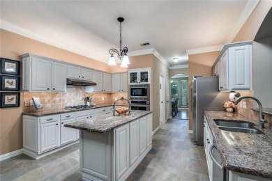 STUNNING home with 4 bedroom, 2.5 bath, 3 living areas in on Firewheel Golf Park in Texas - for sale on GolfHomes.com, golf home, golf lot
