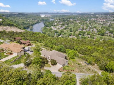 Gorgeous views from this home perched on a hilltop overlooking on Pointe Royale Village Country Club in Missouri - for sale on GolfHomes.com, golf home, golf lot