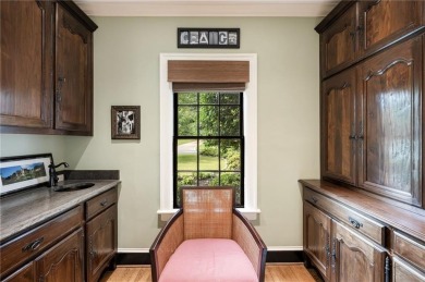 Tucked in the heart of Haynes Manor, this timeless traditional on Bobby Jones Golf Club in Georgia - for sale on GolfHomes.com, golf home, golf lot