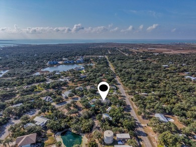 Tucked beneath a canopy of majestic coastal live oaks in the on Lamar Golf Course in Texas - for sale on GolfHomes.com, golf home, golf lot