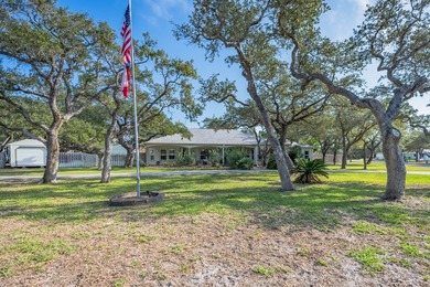 Tucked beneath a canopy of majestic coastal live oaks in the on Lamar Golf Course in Texas - for sale on GolfHomes.com, golf home, golf lot